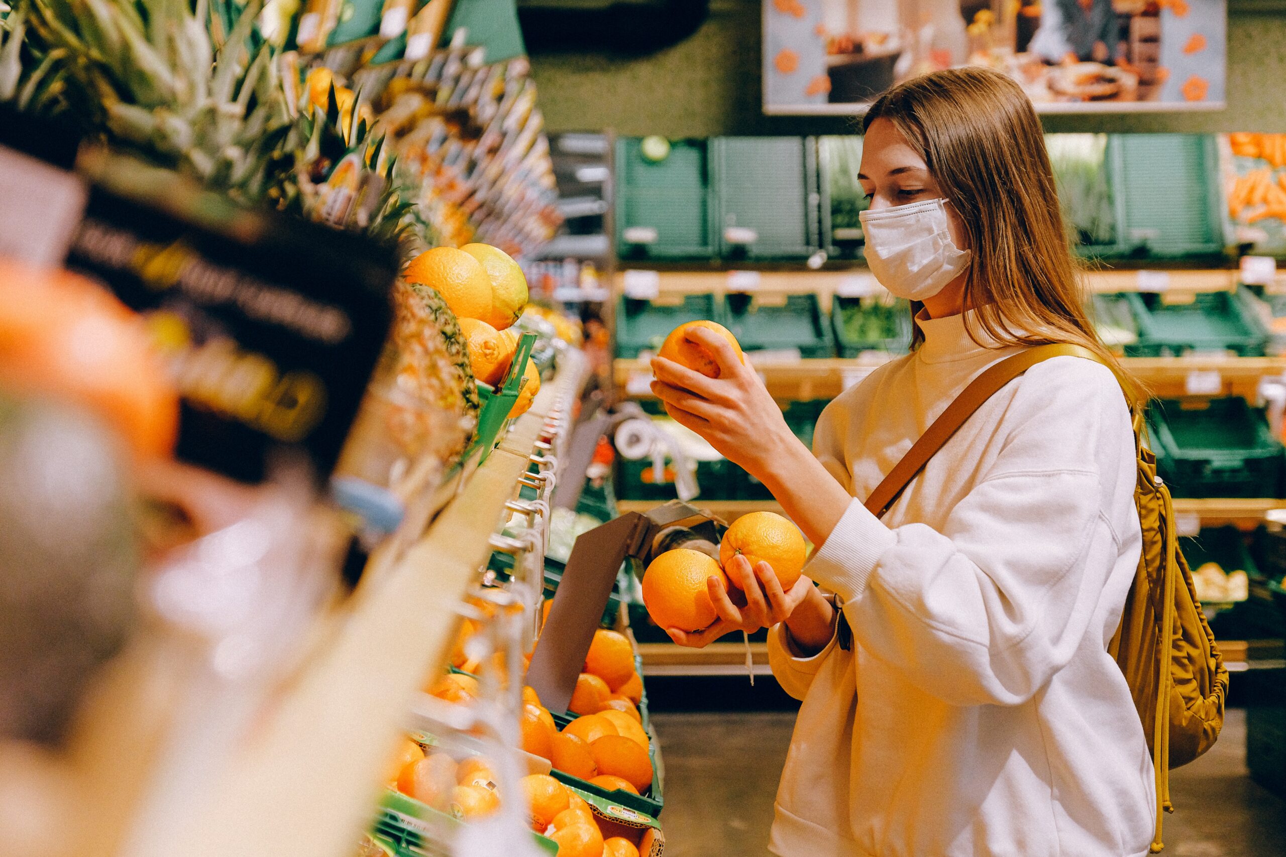 woman-picking-fruits-in-grocery
